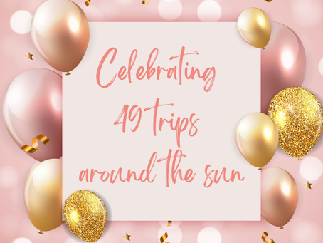 pink background with balloons and text that says celebrating 49 trips around the sun
