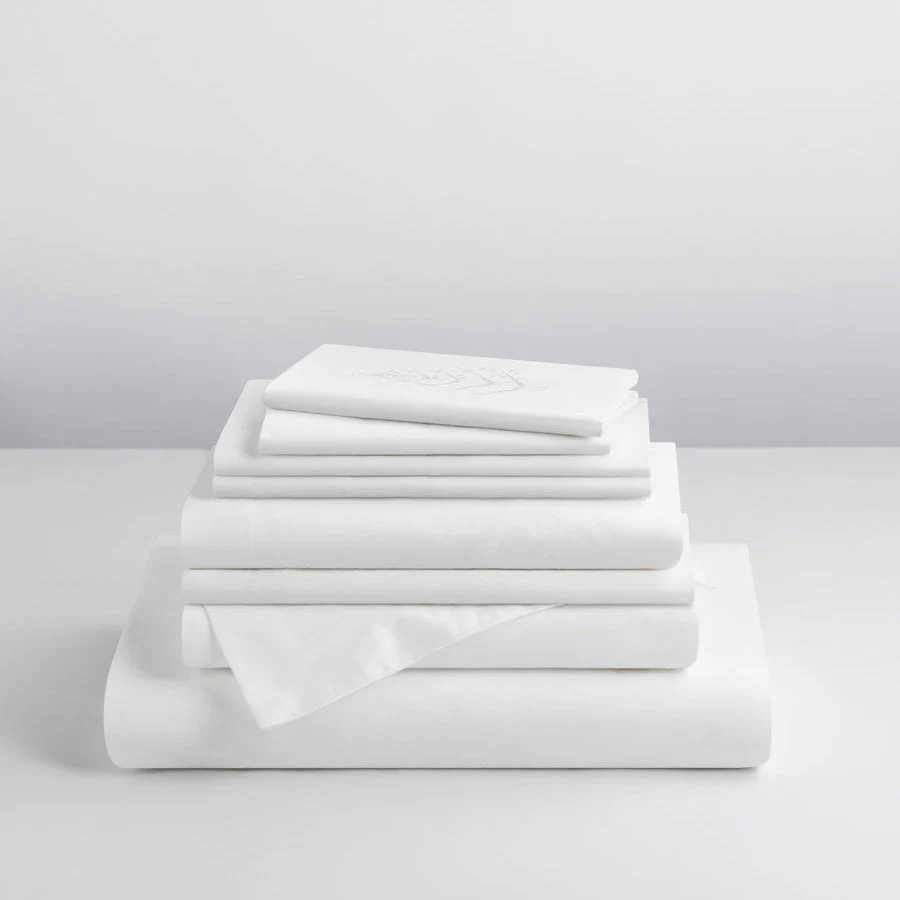 Folded Four Seasons Signature Hotel Linen Set including luxury sheets and pillowcases made from premium hotel-quality cotton.