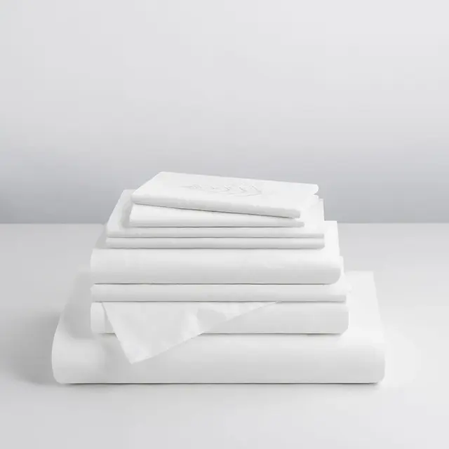 Folded Four Seasons Signature Hotel Linen Set including luxury sheets and pillowcases made from premium hotel-quality cotton.