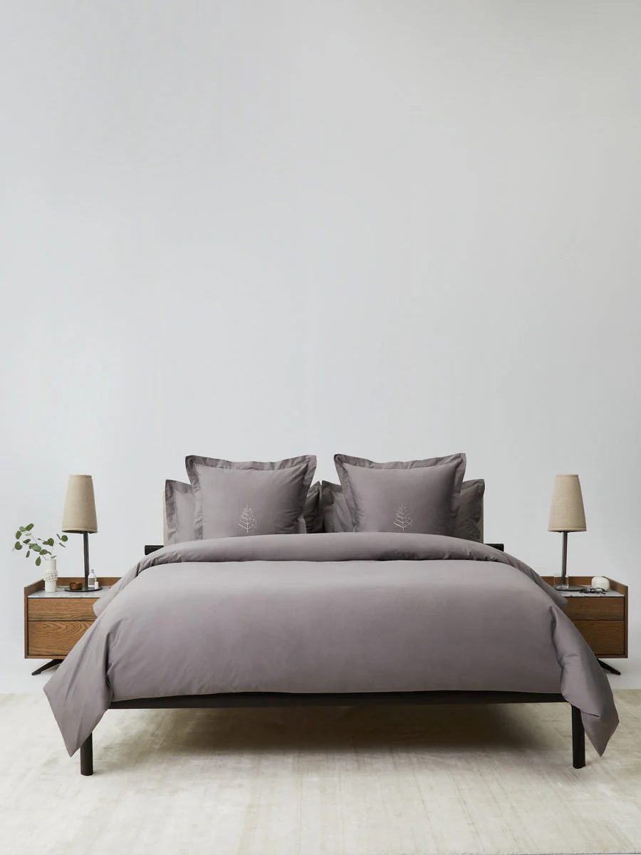 Luxury hotel bedroom styled with the Four Seasons Signature Hotel Linen Set in elegant gray bedding for a timeless five-star hotel look.