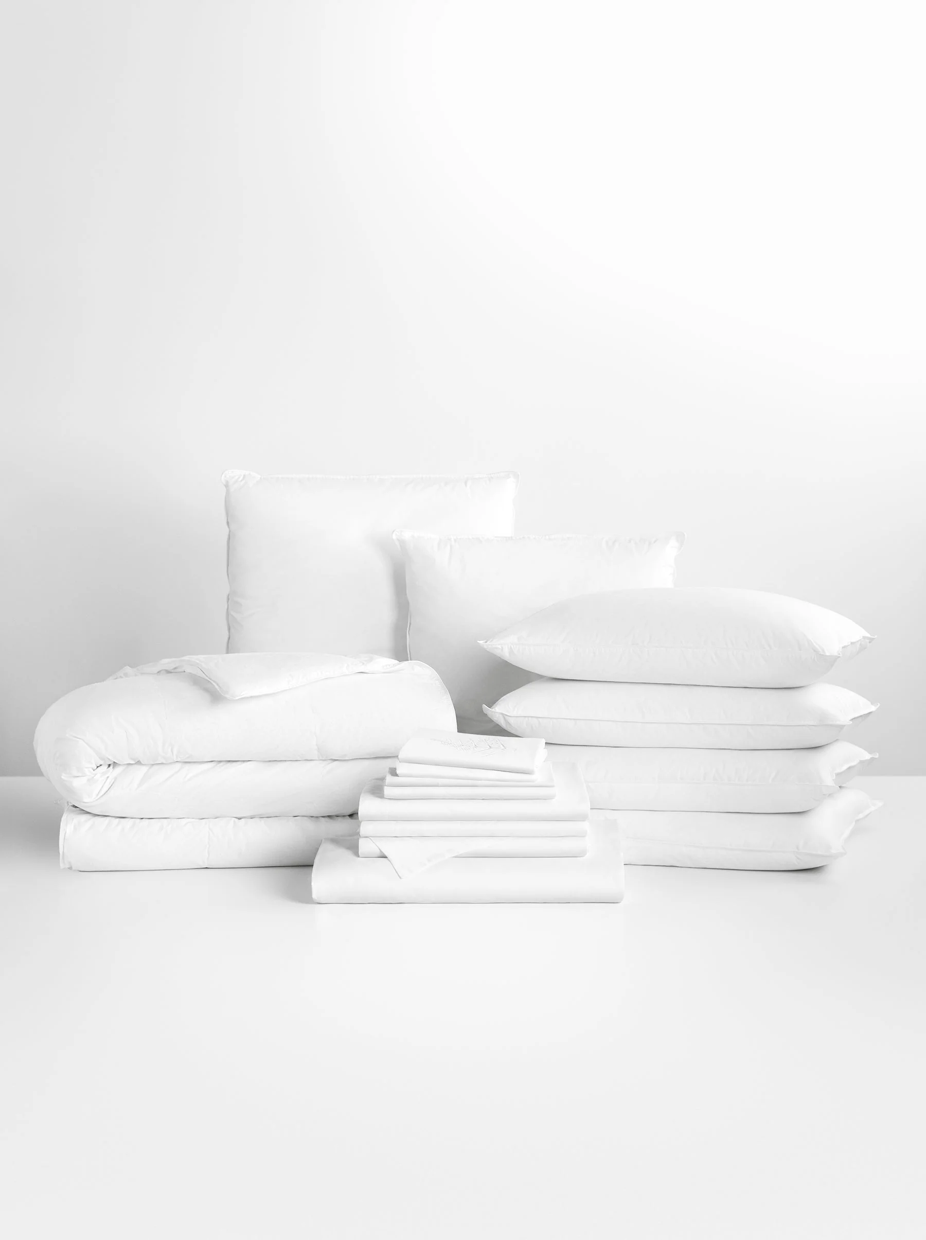 Luxury hotel bedroom essentials including premium pillows, fluffy duvet, and luxury bedding from the Four Seasons Home Collection.