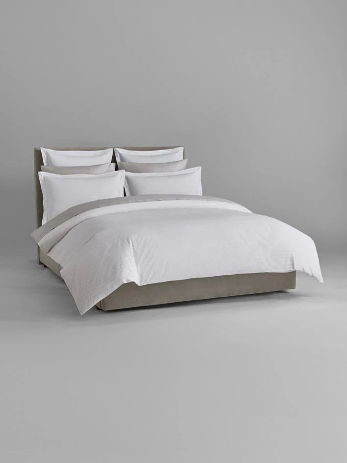 Four Seasons Banyan Duvet Cover Set displayed on a modern bed with luxury white bedding for a timeless hotel bedroom look.