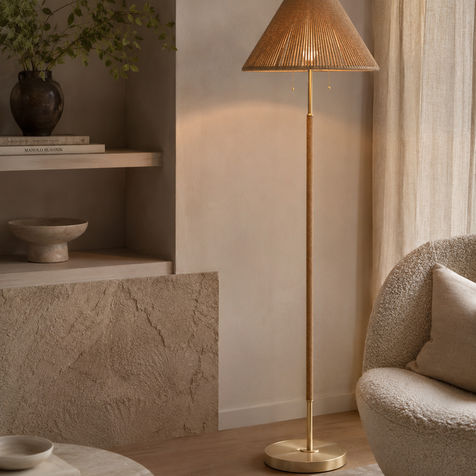 Modern brass floor lamp with a woven natural linen shade for warm ambient lighting, quiet luxury, organic modern, and contemporary home decor.