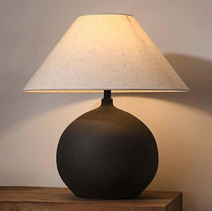 Sandyha table lamp with neutral ceramic base and linen shade on a modern side table