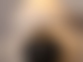 Sandyha table lamp with neutral ceramic base and linen shade on a modern side table