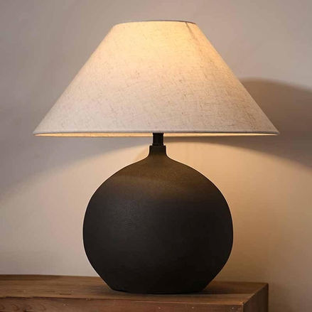 Sandyha table lamp with neutral ceramic base and linen shade on a modern side table