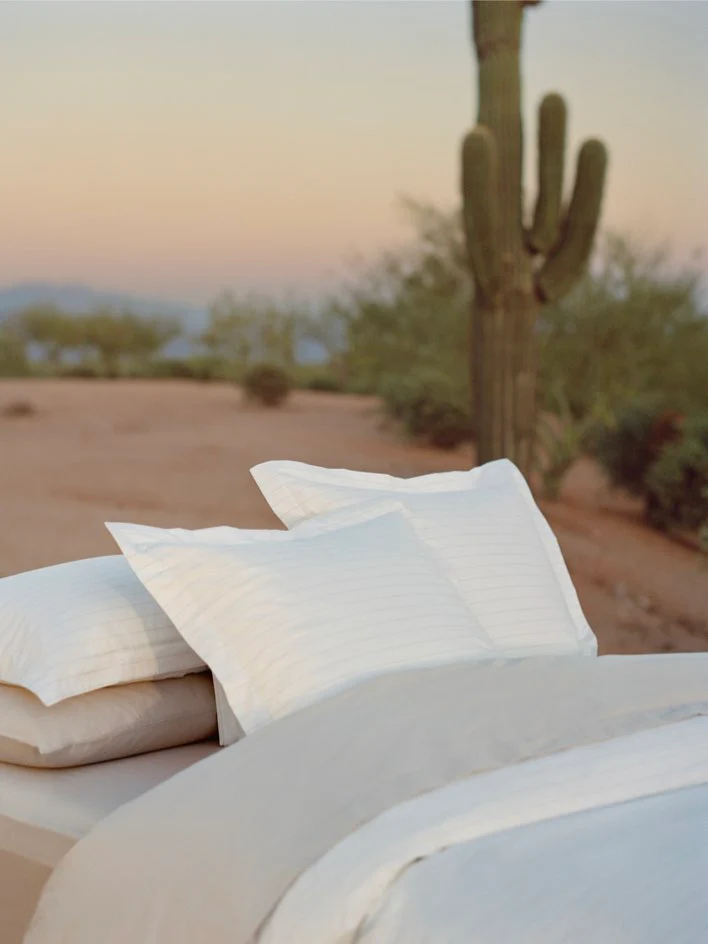 Luxury hotel bedroom styled with the Four Seasons Banyan Duvet Cover Set, crisp white bedding, and serene resort-inspired surroundings