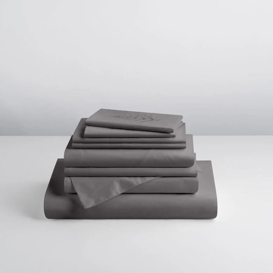 Folded Four Seasons Signature Hotel Linen Set showcasing premium gray sheets and pillowcases for a luxury hotel bedroom.