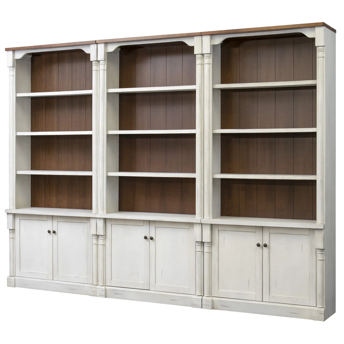 Classic white storage bookcase with warm wood backing, open shelves, and cabinet storage. Inspired by Nancy Meyers home interiors, this timeless library wall combines traditional design, custom built-in style, and quiet luxury decor for an elegant and inviting living space.