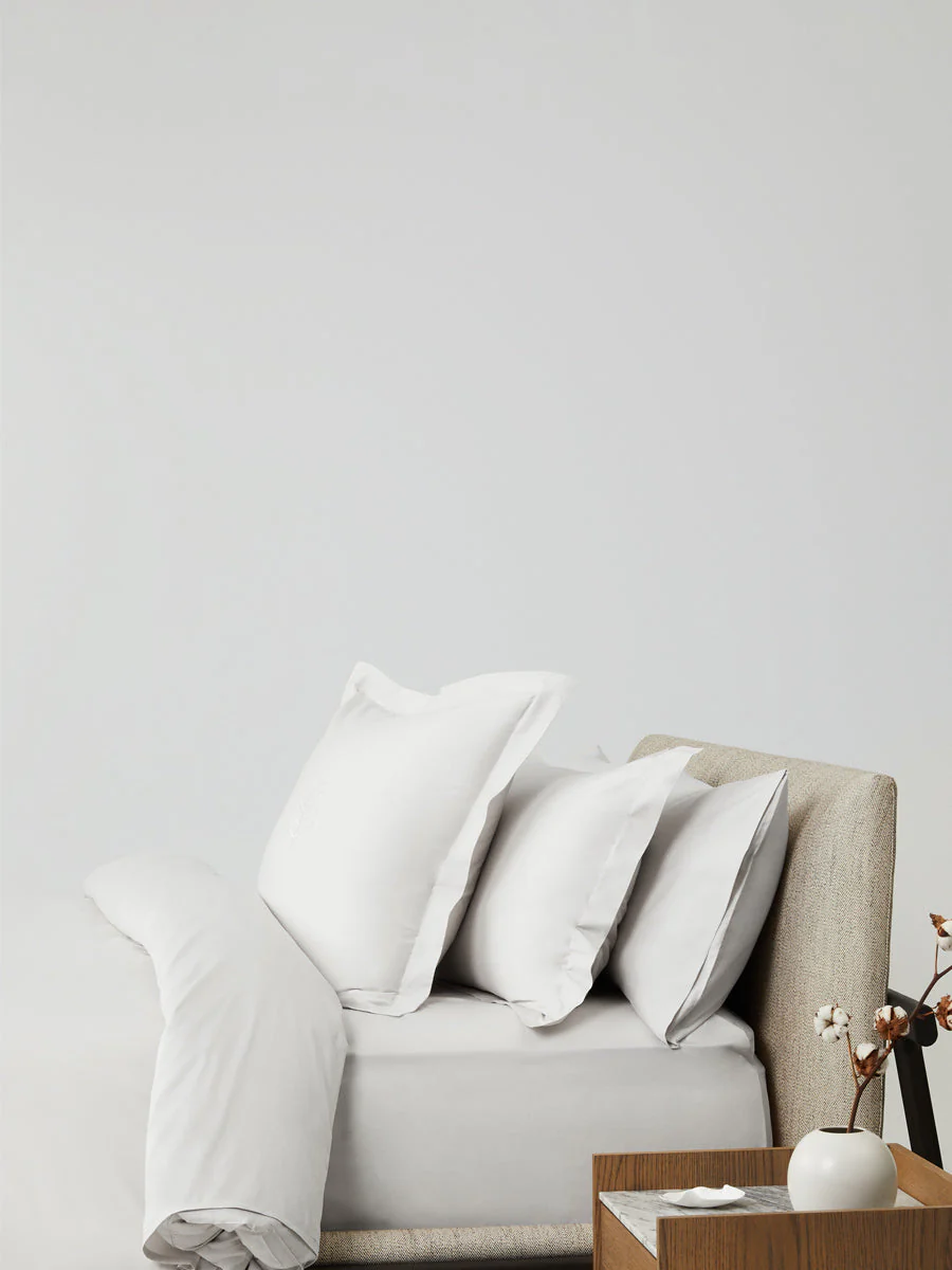 Luxury hotel bedroom featuring the Four Seasons Signature Hotel Duvet Cover Set with crisp white pillows and timeless minimalist décor.