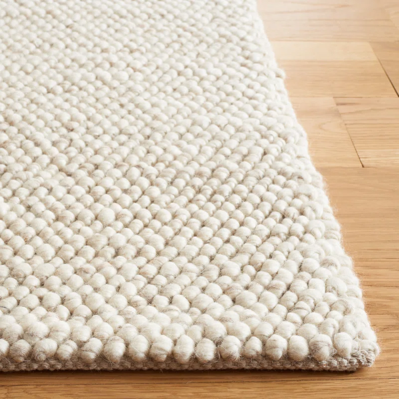 zoom textured wool rug with small bubble pattern in beige tones