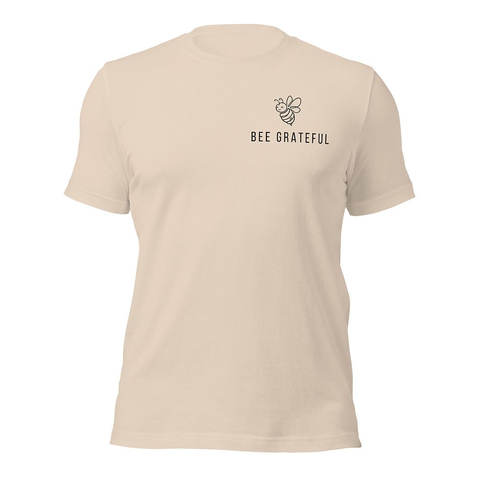 Men’s minimal bee t-shirt in beige with small bee illustration and “Bee Grateful” text on chest