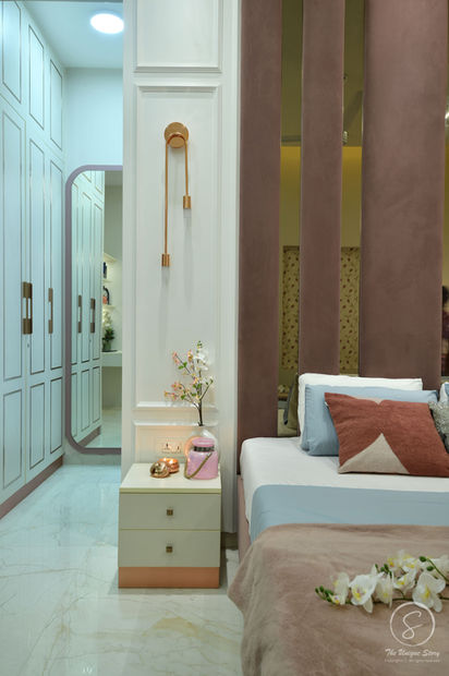 Contemporary bedroom design with a designer bed, integrated shelving, modern wardrobes, accent lighting, and sophisticated residential interiors