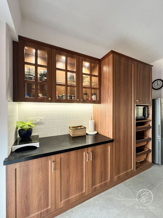 Custom modular kitchen India with wooden finishes and appliance storage units