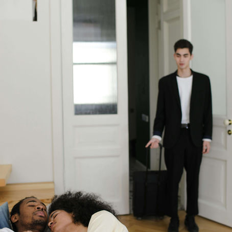 Partner walks in to find two people cuddling, capturing the shock of infidelity. Couples and relationship therapy or online couples therapy in California with a skilled couples therapist in San Diego, CA can help process the rupture and decide next steps.