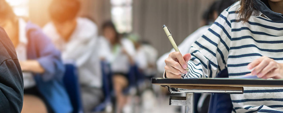 Image of a classroom of teens taking an exam | therapy for teens in manhattan, ny | teen therapist in manhattan, ny | exam stress | anxiety in teens | online therapy for teens | 11215 | 10075 | 10007