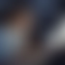 A tired professional woman sitting at her desk late at night, head in her hand, staring at her computer screens with exhaustion. This image reflects the hidden toll of high-functioning anxiety that burnout treatment in Denver, CO can help address. If this feels familiar, online therapy for anxiety in Denver, CO may be a helpful next step.