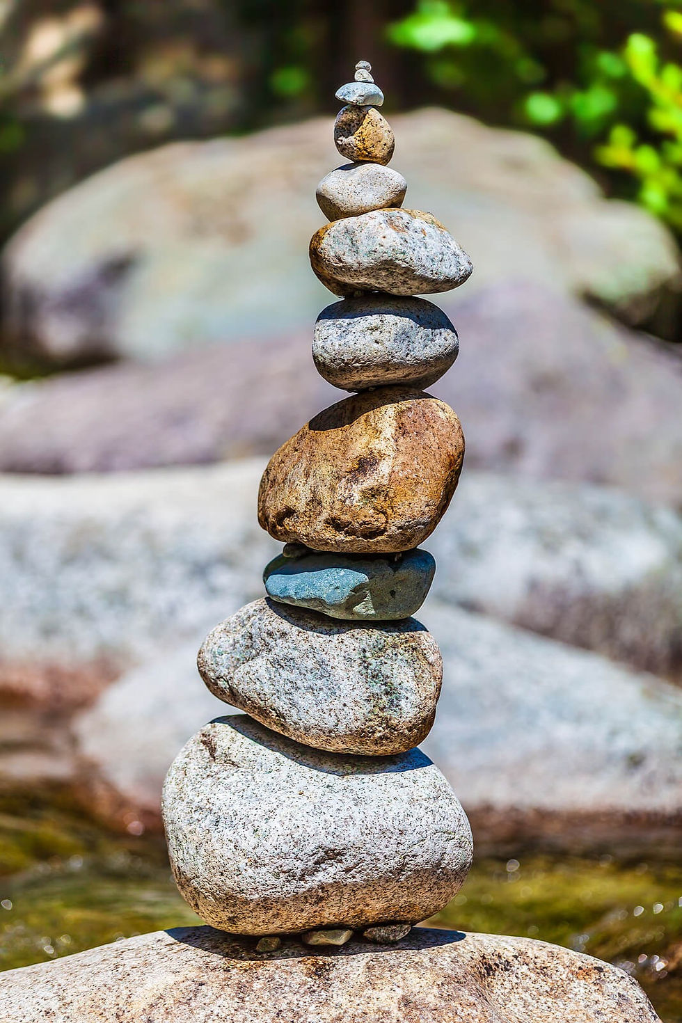 Zen rock stacking representing mindfulenss | counseling in tualatin | counseling in Portland | online therapy for busy professionals | therapy for professionals | 97062 | 97034 | 97035