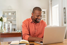 African American Man on laptop for Telehealth or online therapy in Wisconsin, powered by simplepractice for online therapists doing telemental heatlh or telehealth in Wisconsin