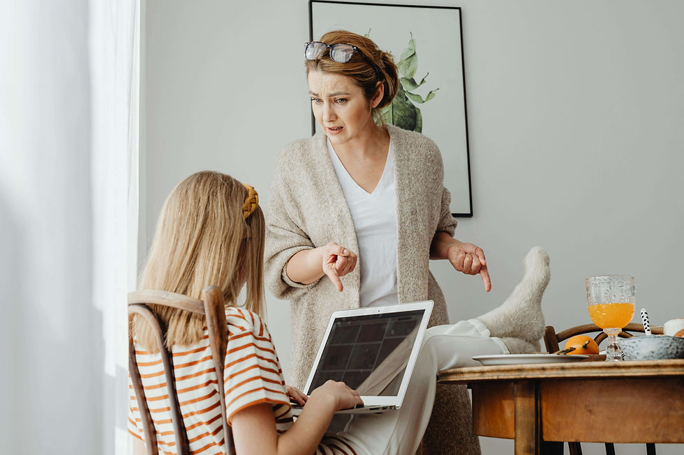 Frustrated mother scolding her daughter at the table | parent coaching in Boulder County, CO | parent coaching therapy | parent coaching services | Arapahoe | Foothills | Boulder County