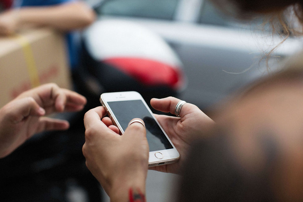 Close-up of a person scrolling on their phone, illustrating efforts to maintain connections and process separation with support from a therapist for immigrants in NYC | therapist for immigrants nyc - immigrant therapy nyc - south asian therapy nyc