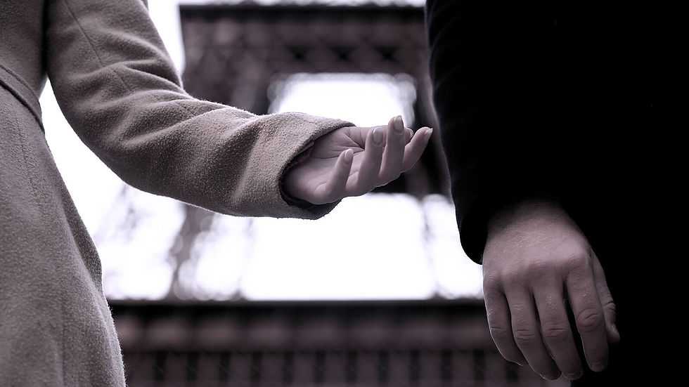 A close-up of a person reaching out for their partner to no reception. Learn more about the support an online therapist in Georgia can offer from the comfort of home. They can offer healthy relationship counseling in Atlanta, GA, and more.