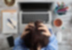 Image of woman looking overwhelmed at her desk | stress Atlanta, GA | burnout | therapy for stress | 30081 | 30082 | 30080