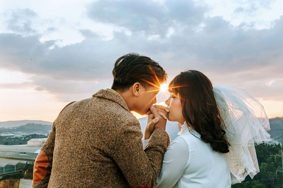 Couple sharing a tender moment at sunset during a wedding, reflecting emotional bonds and cultural expectations explored in therapy for Asian marriage culture in NYC | therapy for asian marriage culture nyc - south asian marriage counseling nyc - south asian mental health nyc
