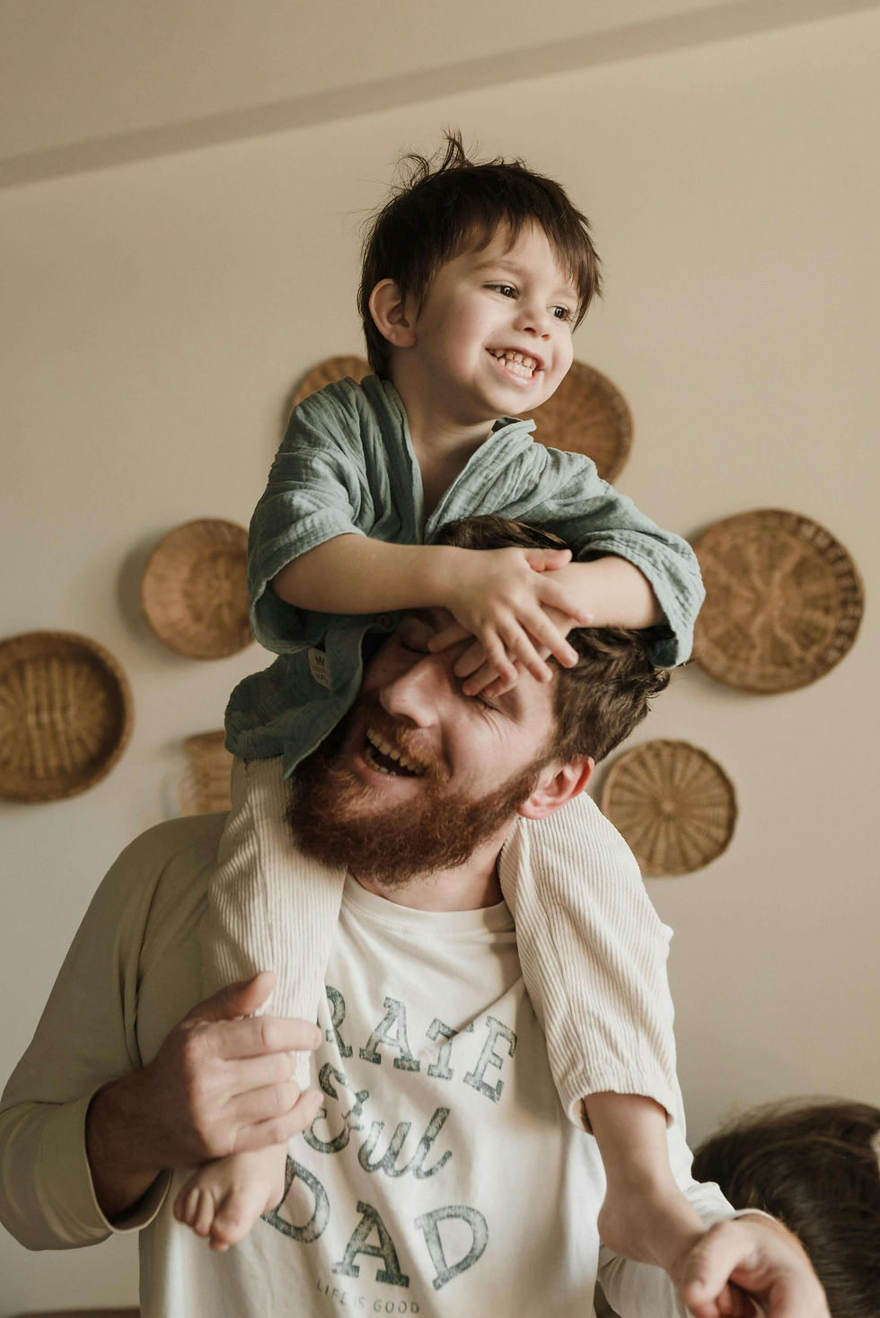 Young boy on a man's shoulders, both smiling | single session parent coaching in Boulder County, CO | parent coach | parent coaching services | Boulder County | Boulder | Louisville