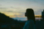 Silhouette of a woman in side profile outdoors looking thoughtful, representing identity exploration supported through immigrant therapy in NYC | immigrant therapy nyc - immigrant grief therapy nyc - south asian therapist nyc
