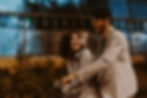 Smiling couple rides a bicycle at night, laughing together in light jackets | anxiety therapy in Manhattan, NY | therapist for anxiety | anxiety in relationships | Midtown | Tribeca | Gramercy Park
