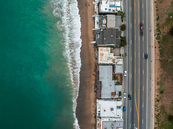 Malibu beach aerial view in California near Los Angeles, USA. Waves hitting the shore near