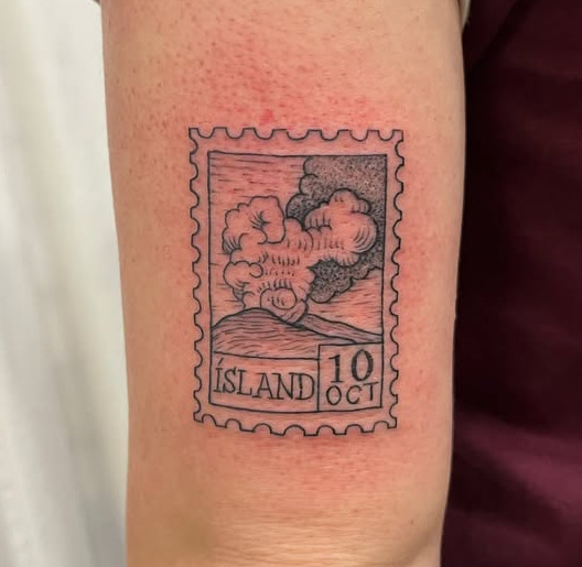 Detailed fine line postage stamp tattoo with landscape imagery and black and grey shading, created at Linden Street Tattoo Company in Fort Collins, Colorado.