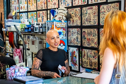 First time tattoo client chatting with Toni at Linden Street Tattoo Company in Fort Collins colorado
