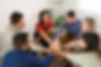 members-support-group-putting-their-hands-together-make-high-five-cheerful-young-women-men