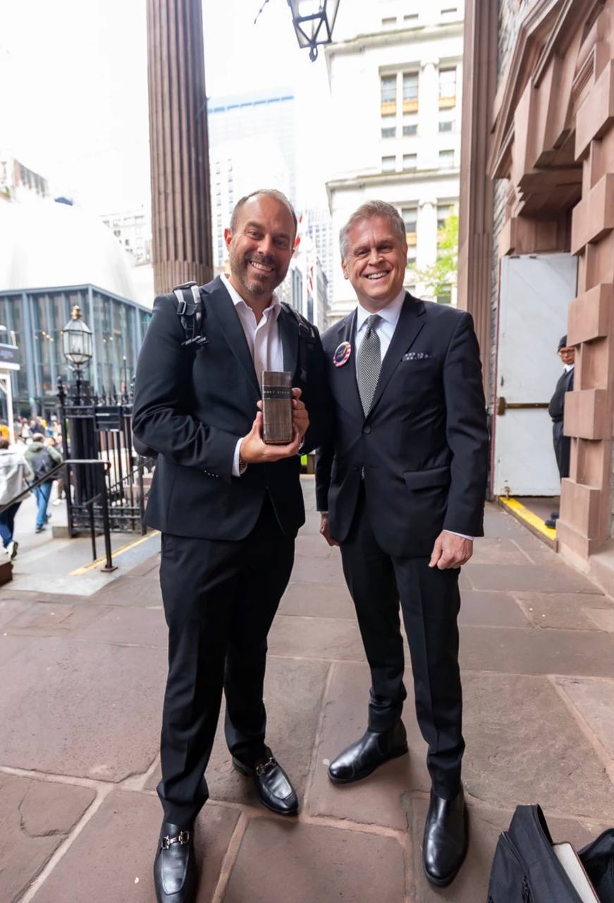 Jimmy Hayes holding the Aitken Bible outside Federal Hall — April 30, 2026