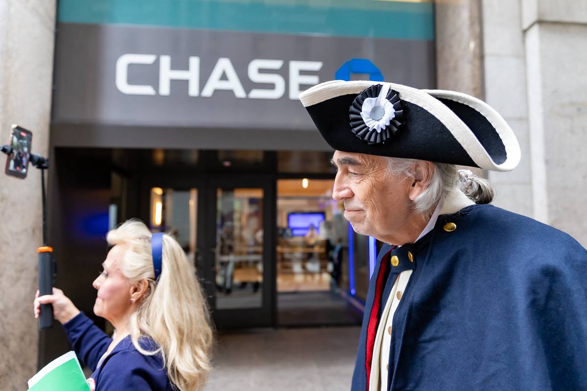 George Washington reenactor walking past Chase Bank in Lower Manhattan — April 30, 2026