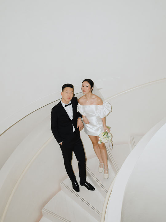 Afterpartybride Mini wedding gown singapore mini wedding gown after wedding gown bespoke gown custom wedding gown make short gowns Singapore custom rom gown

Mini wedding gown keywords 
Bride wearing an Afterpartybride mini wedding gown in Singapore, styled as a two-piece convertible wedding gown with detachable skirt — perfect as an ROM gown, after-party dress, or evening gown. Features a short bridal mini dress silhouette with a long overskirt for a custom, 2-in-1 bridal look. Afterpartybride specialises in bespoke and custom wedding gowns in Singapore, including mini bridal gowns, long wedding gowns, mini with skirt wedding gowns, and little white dresses. Explore our bridal shop in Singapore for unique after party bride styles and modern short wedding gowns tailored for ROM, solemnisation, or reception wear.

Wedding gown keywords
Afterpartybride is a local designer bridal shop in Singapore offering exclusive designer wedding gowns for modern brides. Our bridal boutique features custom-tailored bridal gowns, mini gowns, and fine art wedding pieces. As a top wedding brand bridal studio Singapore, we focus on perfect fit, high quality craftsmanship, and luxurious design details. Discover our wedding packages in Singapore at our affordable yet high-end bridal studio — perfect for brides searching for a wedding gown Singapore, bridal shop Singapore, or wedding studio near me.

Afterparty Occassion use Keywords
Afterpartybride is a Singapore bridal studio offering modern brides a curated collection of mini wedding gowns, after party gowns, 2-in-1 wedding gowns, convertible bridal gowns, and 2-piece gowns. From cocktail gowns and jumpsuits to evening gowns and reception looks, each piece is crafted with detail and custom fit. Perfect for overseas weddings, pre-wedding shoots, and gown rental for overseas photoshoots. Discover reception gowns, mini gowns with skirts, and bespoke wedding gowns at one of Singapore’s top local designer bridal studios.

Behind the scenes
Behind-the-scenes wedding and event videography by Afterpartybride capturing candid, documentary-style moments with multi-angle iPhone cinematic filming, including on-site coverage for your chosen hours, a pre-event content planning call, a full unfiltered gallery delivered within 48 hours, two edited 1-minute Instagram reels delivered within 48 hours, and a dedicated main videographer documenting weddings, ROM, proposals, bridal showers, bachelorette parties, pre-wedding shoots, gala dinners, fashion events, talks, launches and personal prep-day stories across Singapore. Content creators. Behind the scenes videography. 

