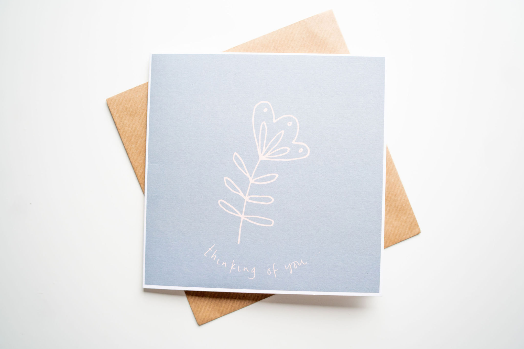 thinking of you - peach flower on grey background