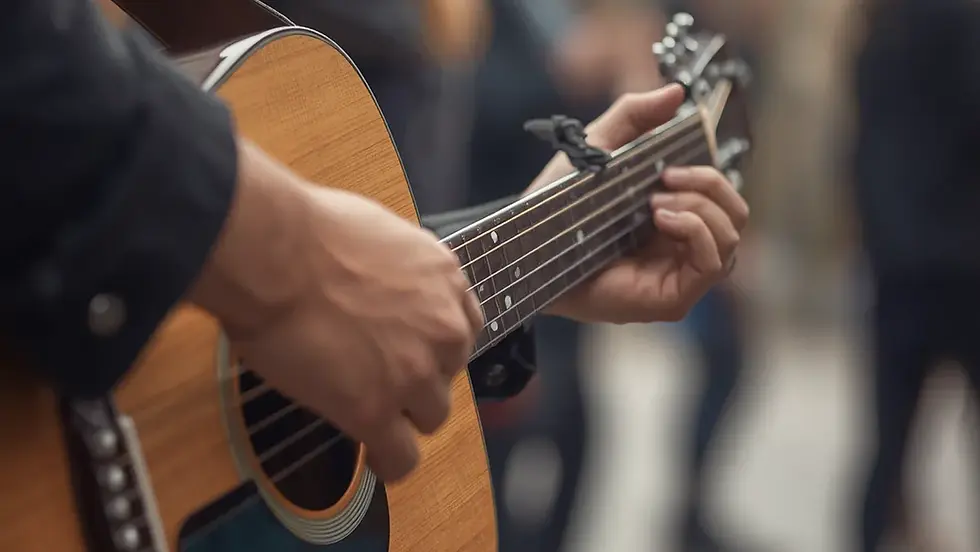 A busker strumming a guitar.