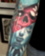 Custom surrealism colour tattoo by Jacob Gwynn Tattoo featuring an original design of a skull and a woman