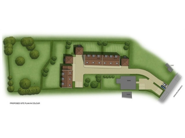 Proposed site plan for three new homes with parking and amenity space