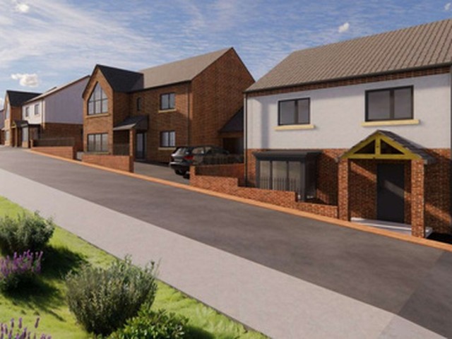 Visual of new detached homes on a street in Cumbria