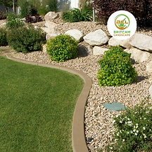 Decorative landscaping with stone pathway and green lawn