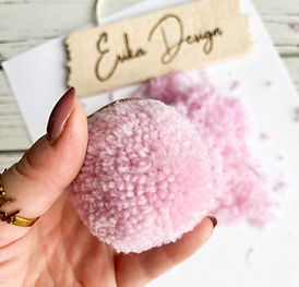 the more you wrap your yarn around the tool, the fluffier the pom will be