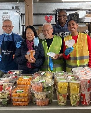 Volunteers sorting food at COA's food bank, helping provide essential items to individuals and families in need.