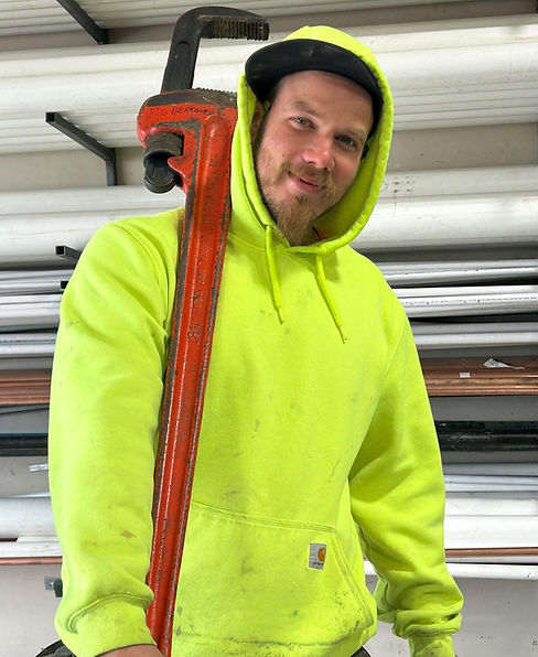 Our journyman plumber Mitch holding our 4ft pipe wrench