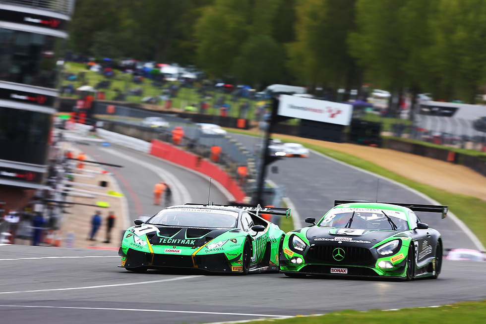 Lamborghini and Mercedes side by side through Paddock Hill Bend during GT World Challenge at Brands Hatch Grand Prix Circuit