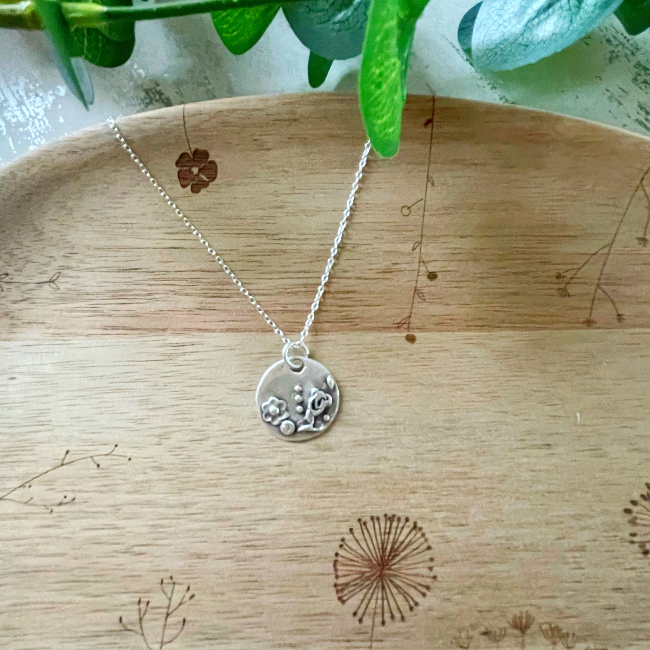 fine silver flowers and leaves pendant, finished with an antique effect