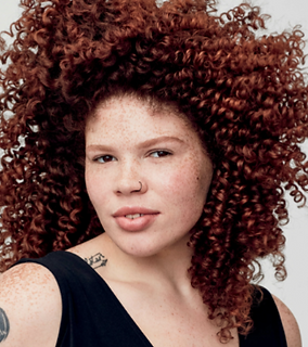 Curly Girl Haircut colored copper and freshly styled.